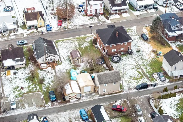 an aerial view of houses with outdoor space