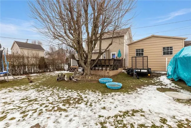 a view of a backyard with furniture