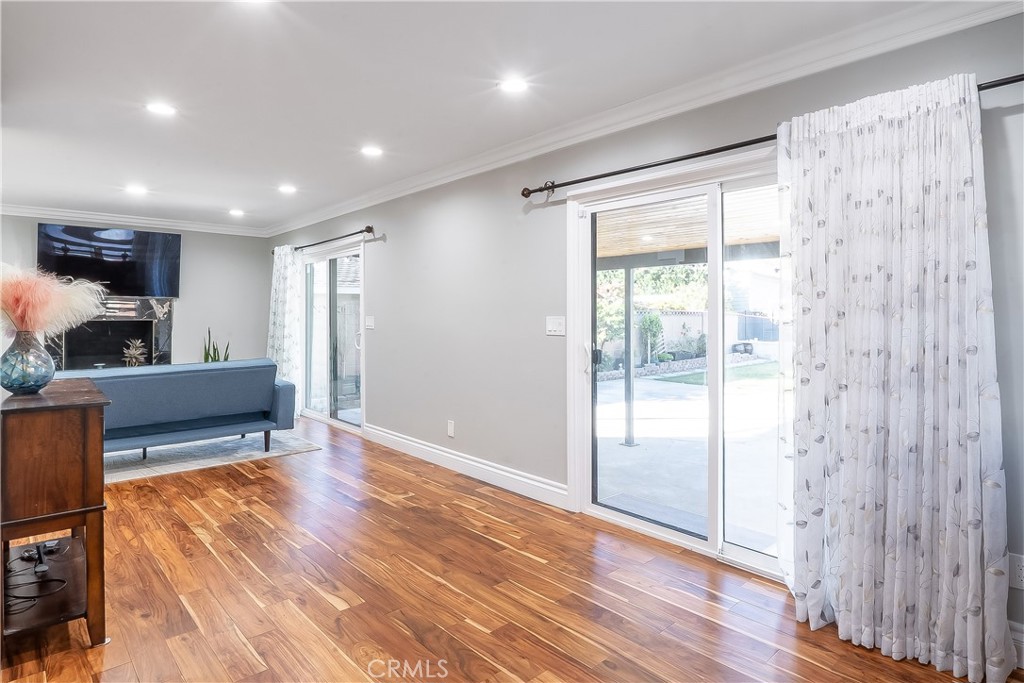 5339 East Greenmeadow Road Long Beach, CA 90808 - Photo 12 of 34 a view of a room with wooden floor and a window