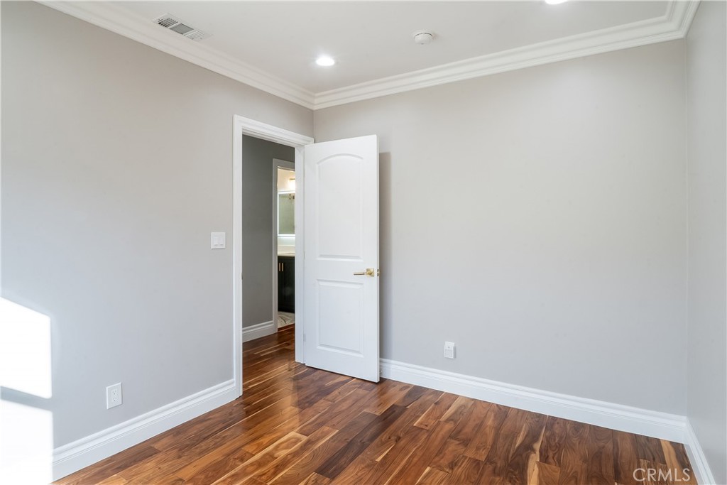 5339 East Greenmeadow Road Long Beach, CA 90808 - Photo 16 of 34 a view of an empty room with wooden floor