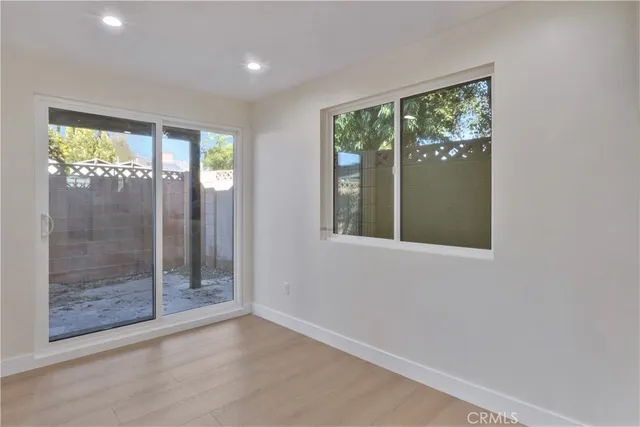 a view of an empty room with glass door