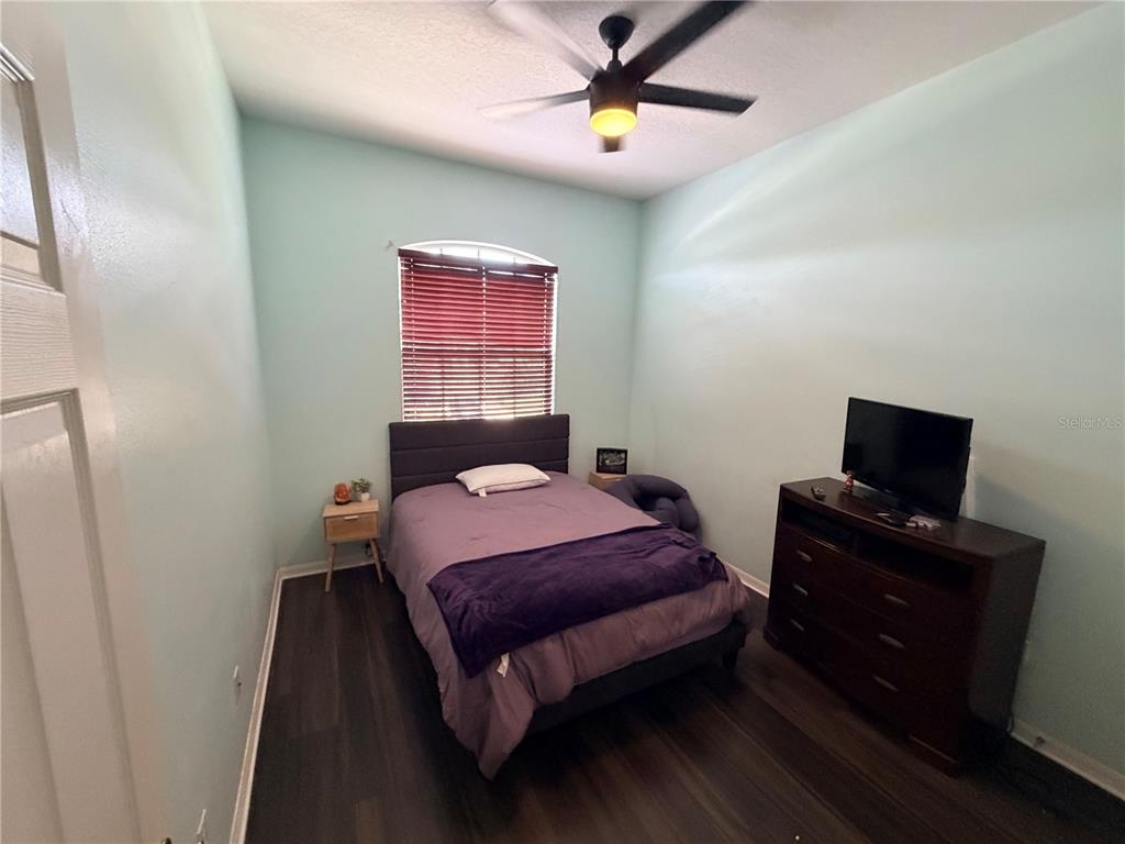 13250 Mandalay Place Spring Hill, FL 34609 - Photo 21 of 28 a bedroom with a bed and a flat screen tv