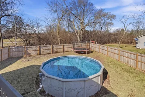 a view of a swimming pool with a patio