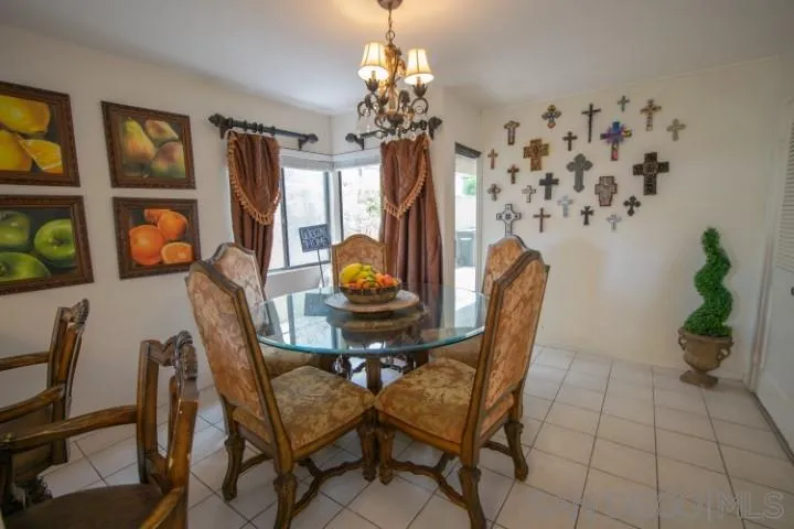 23 Sandpiper Strand Coronado, CA 92118 - Photo 11 of 25 a view of a dining room with furniture and a chandelier