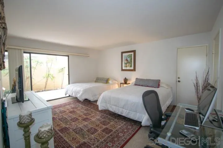 23 Sandpiper Strand Coronado, CA 92118 - Photo 13 of 25 a bedroom with two beds and a large window