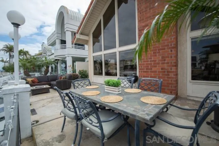 23 Sandpiper Strand Coronado, CA 92118 - Photo 22 of 25 a view of a patio with table and chairs and potted plants