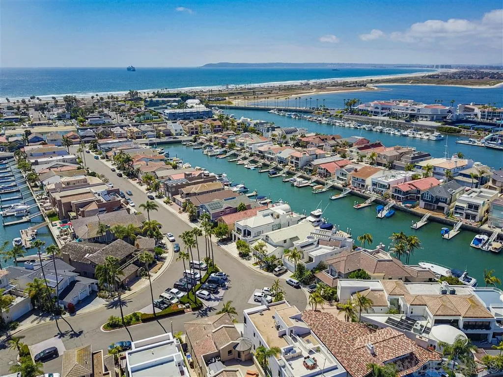 23 Sandpiper Strand Coronado, CA 92118 - Photo 23 of 25 an aerial view of a city with lots of residential buildings and ocean view in back