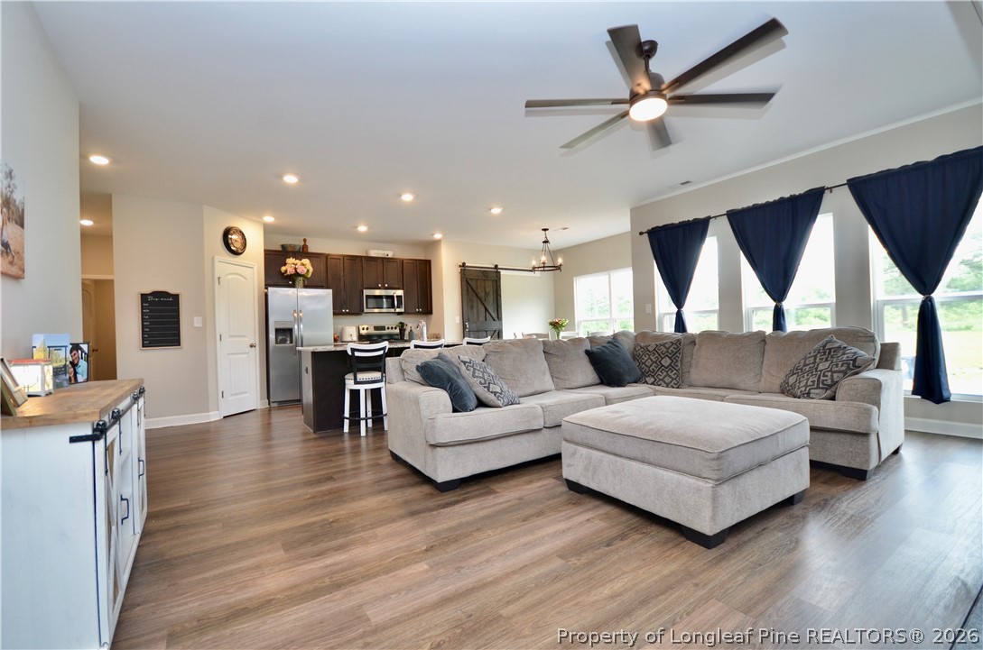 1865 John B Carter Road Fayetteville, NC 28312 - Photo 4 of 49 a living room with furniture and a wooden floor