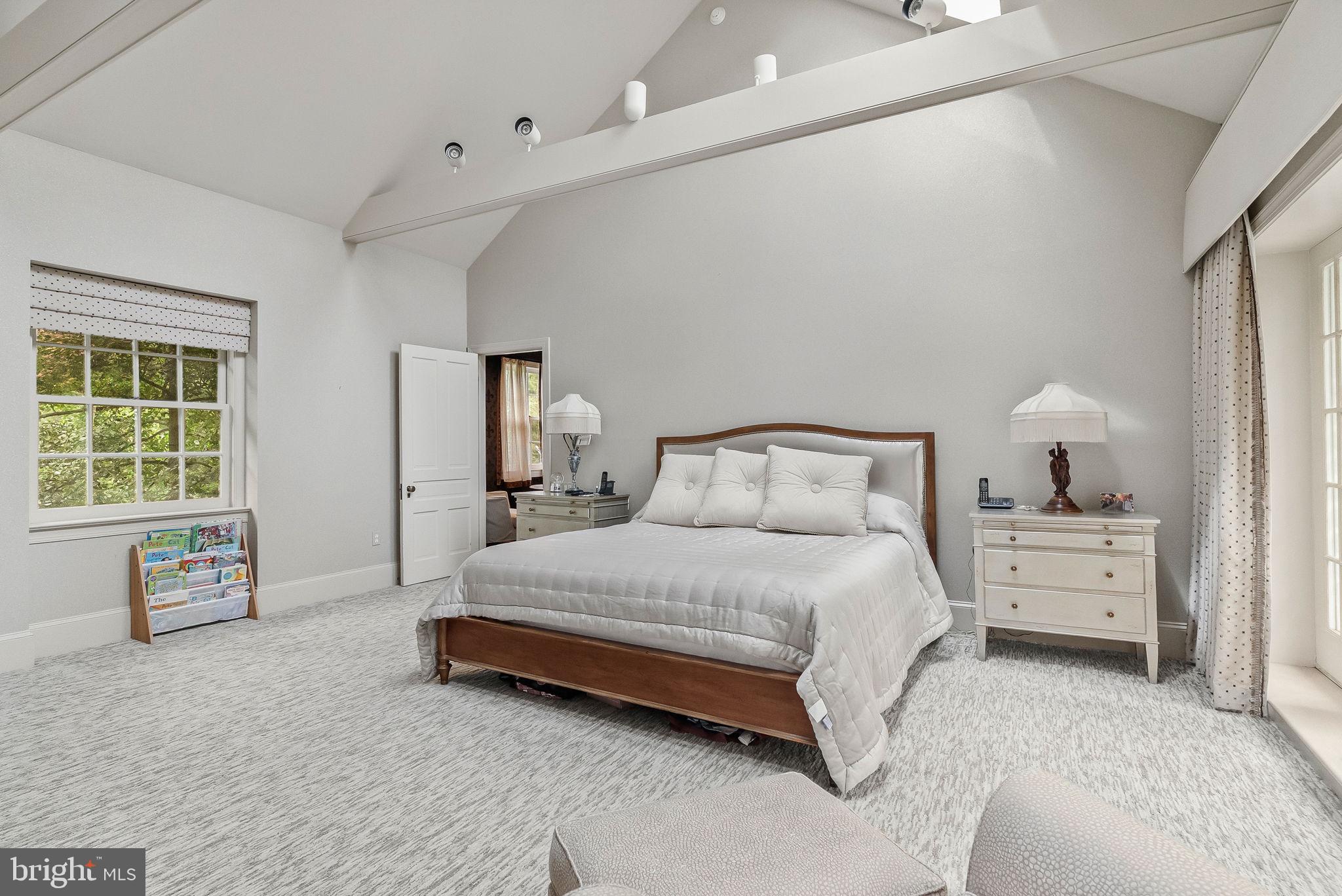 790 Brushtown Road Ambler, PA 19002 - Photo 54 of 104 a spacious bedroom with a bed and large windows