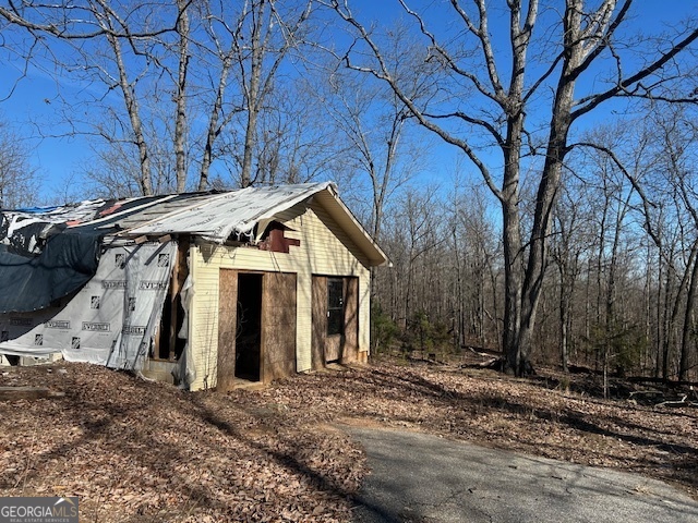 2695 Wildcat Bridge Road Royston, GA 30662 - Photo 6 of 12 a view of a house with a snow covered with snow