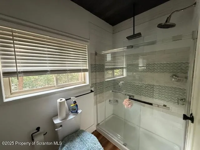 a bathroom with a granite countertop sink and a large mirror