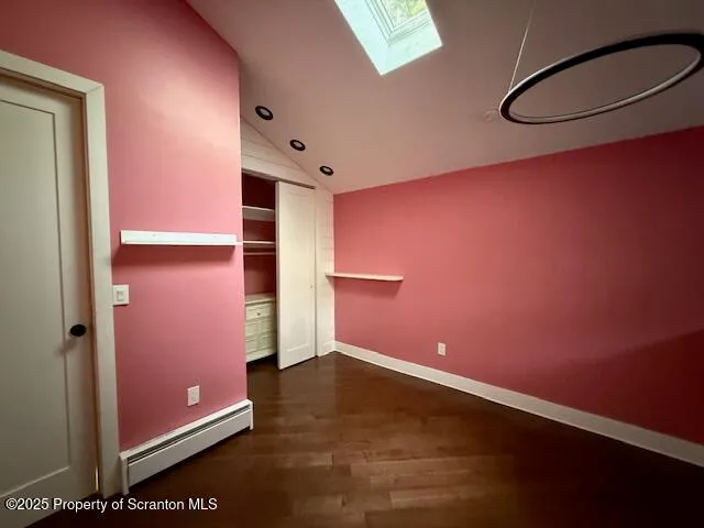 a view of an entryway with wooden floor