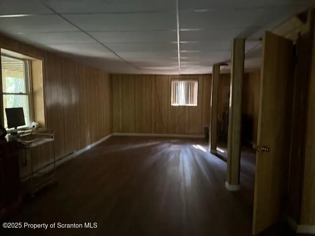 a view of room with window and hardwood