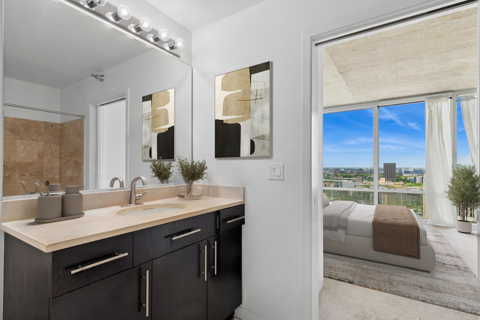 611 South Wells Street, Unit 2904 Chicago, IL 60607 - Photo 13 of 18 a bathroom with a sink double vanity and a mirror
