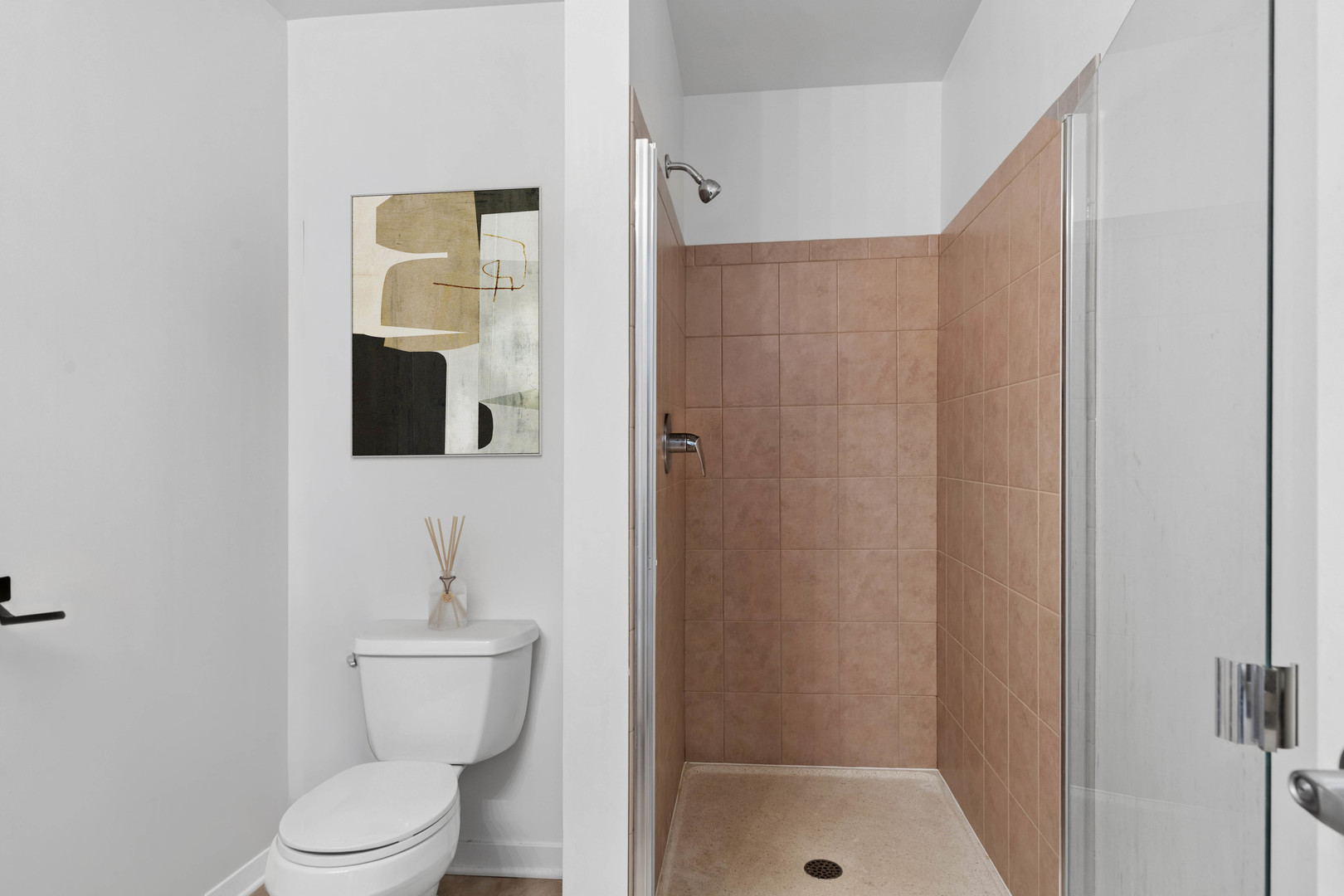 611 South Wells Street, Unit 2904 Chicago, IL 60607 - Photo 15 of 18 a bathroom with a toilet sink and shower