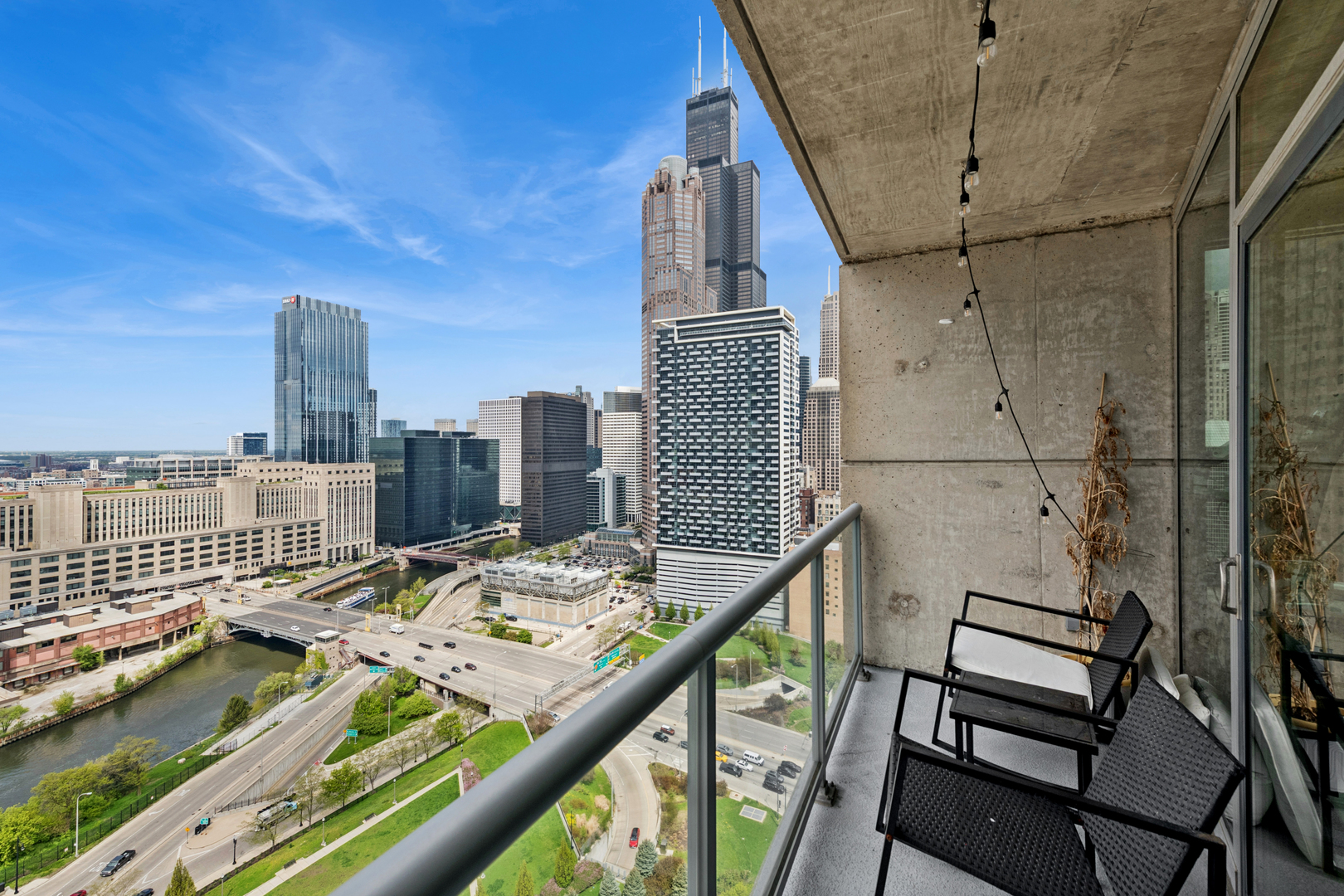 611 South Wells Street, Unit 2904 Chicago, IL 60607 - Photo 16 of 18 a view of a balcony with two chairs and a table