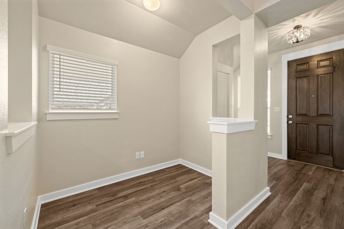 1304 Salt Lick Drive Georgetown, TX 78633 - Photo 7 of 40 an empty room with wooden floor and a window
