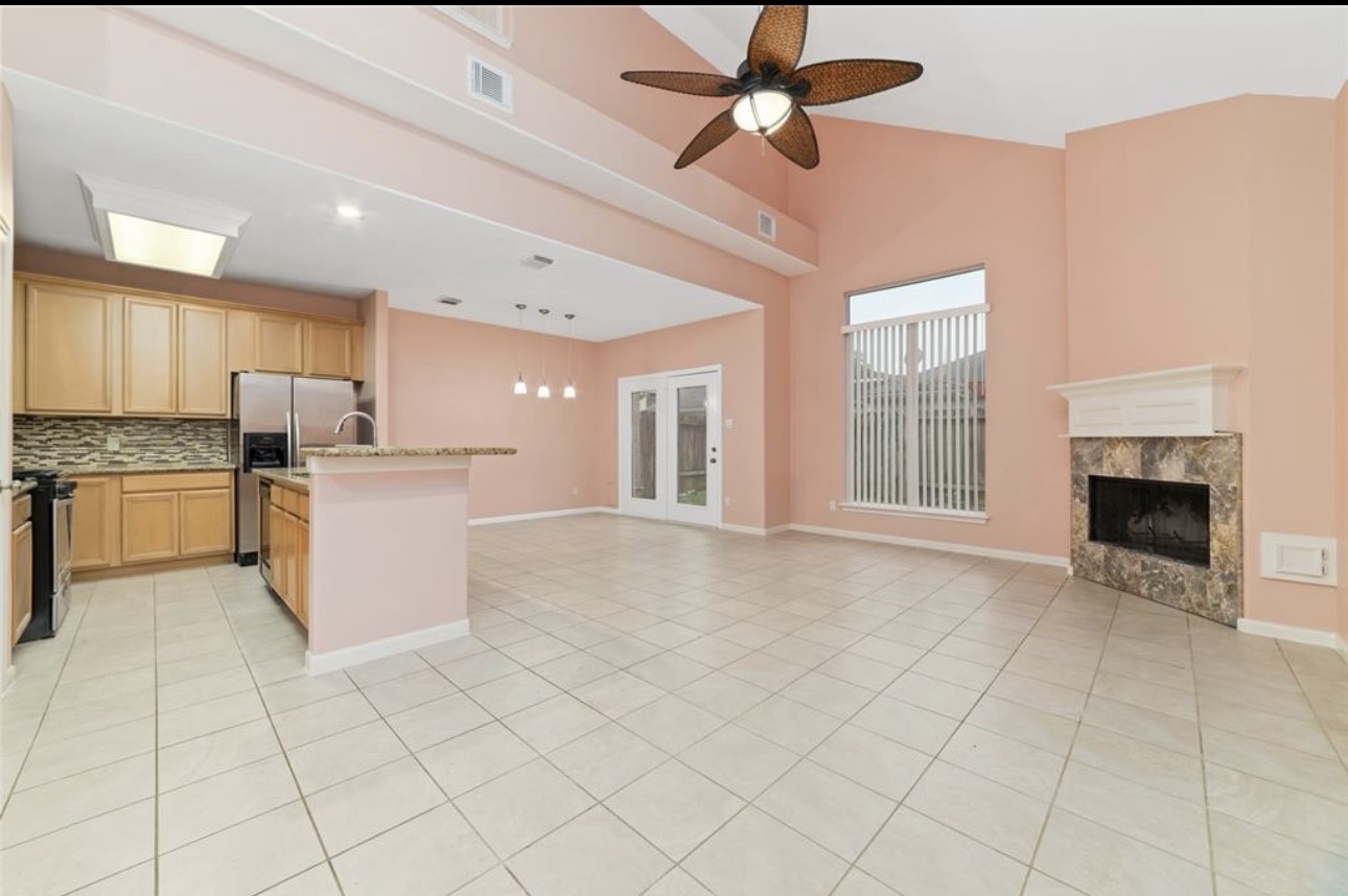 18715 Scented Candle Way Spring, TX 77388 - Photo 12 of 24 a open kitchen with cabinets and stainless steel appliances
