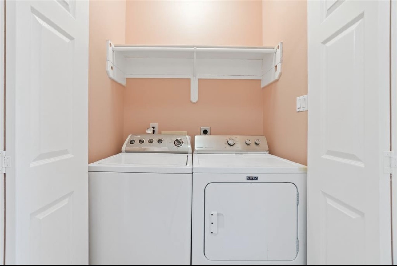 18715 Scented Candle Way Spring, TX 77388 - Photo 15 of 24 a utility room with dryer and washer