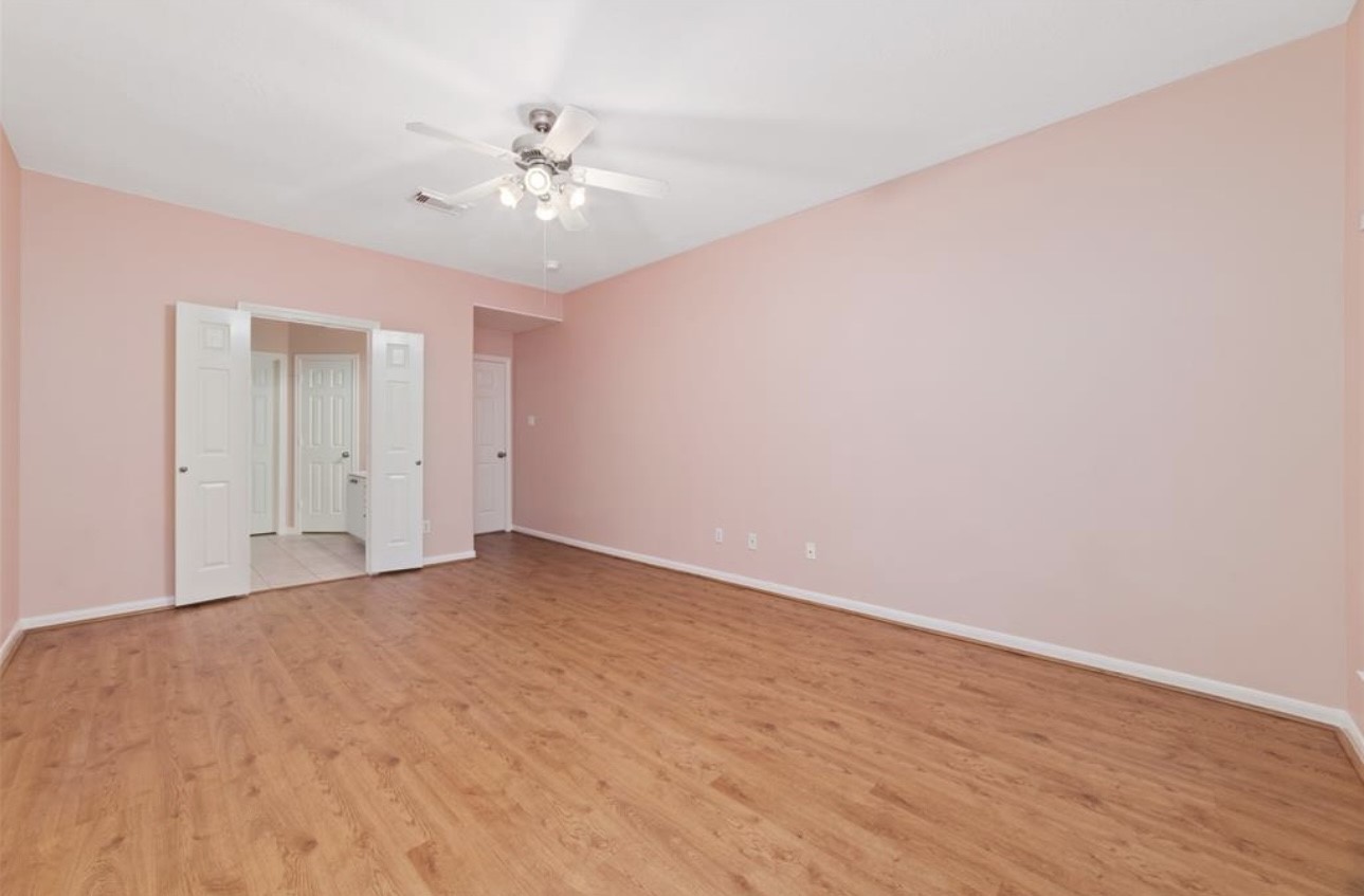 18715 Scented Candle Way Spring, TX 77388 - Photo 17 of 24 a view of an empty room with a chandelier fan