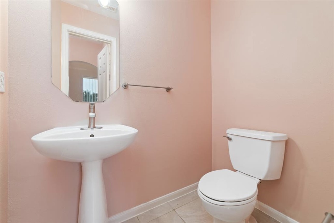 18715 Scented Candle Way Spring, TX 77388 - Photo 18 of 24 a bathroom with a toilet sink and mirror