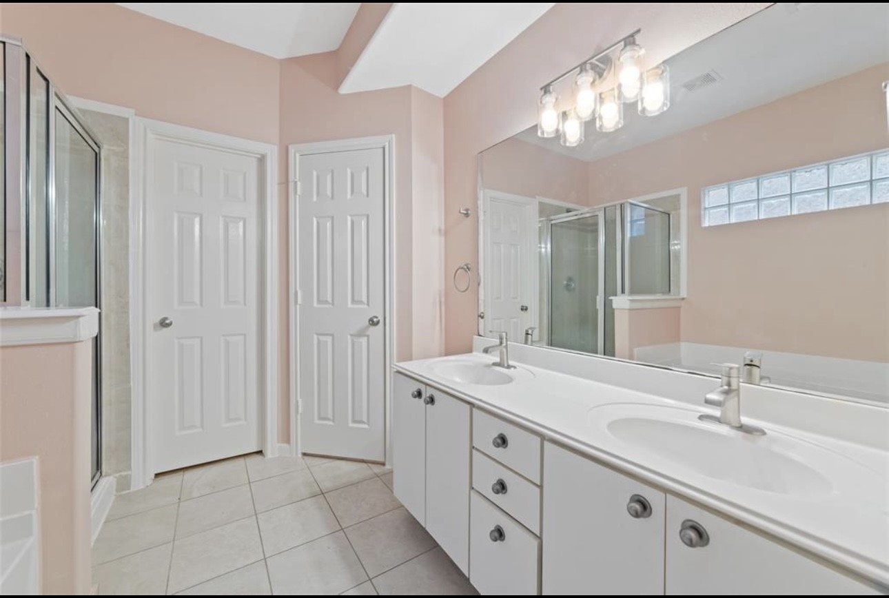 18715 Scented Candle Way Spring, TX 77388 - Photo 19 of 24 a spacious bathroom with a double vanity sink mirror and