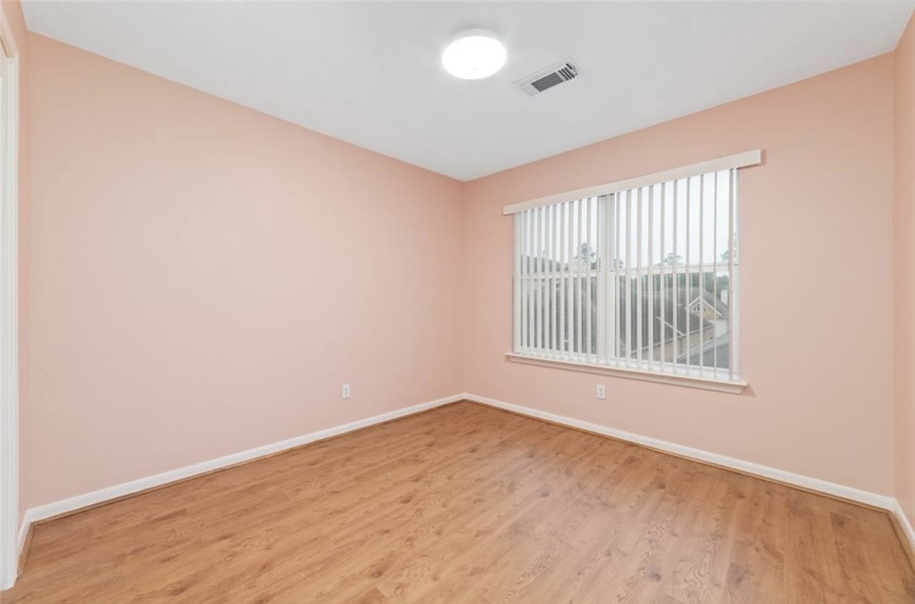18715 Scented Candle Way Spring, TX 77388 - Photo 23 of 24 an empty room with a window