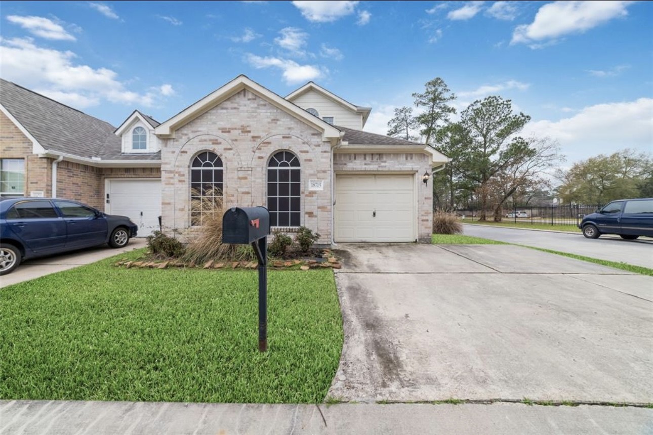 18715 Scented Candle Way Spring, TX 77388 - Photo 4 of 24 a view of a white house with a yard