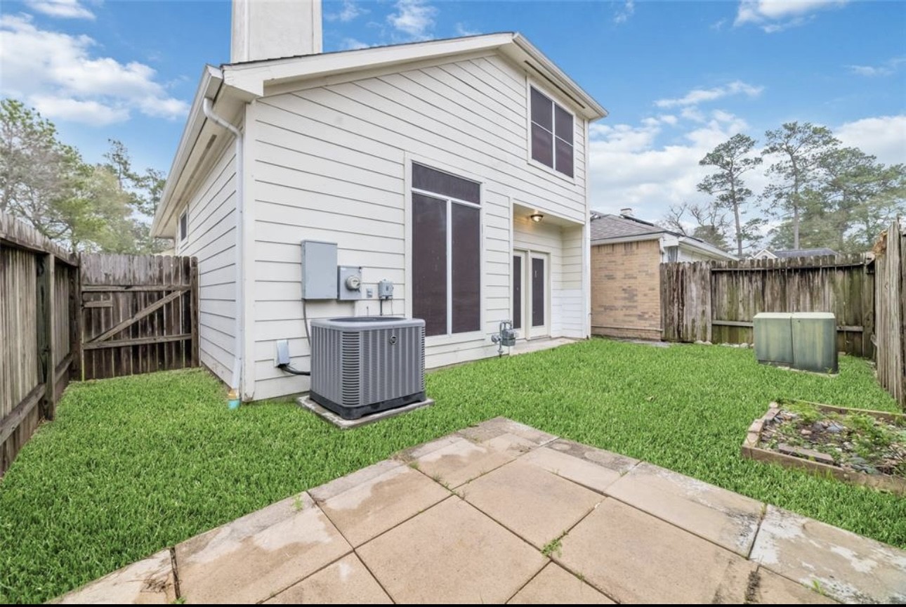 18715 Scented Candle Way Spring, TX 77388 - Photo 5 of 24 a view of a house with a yard and a large tree