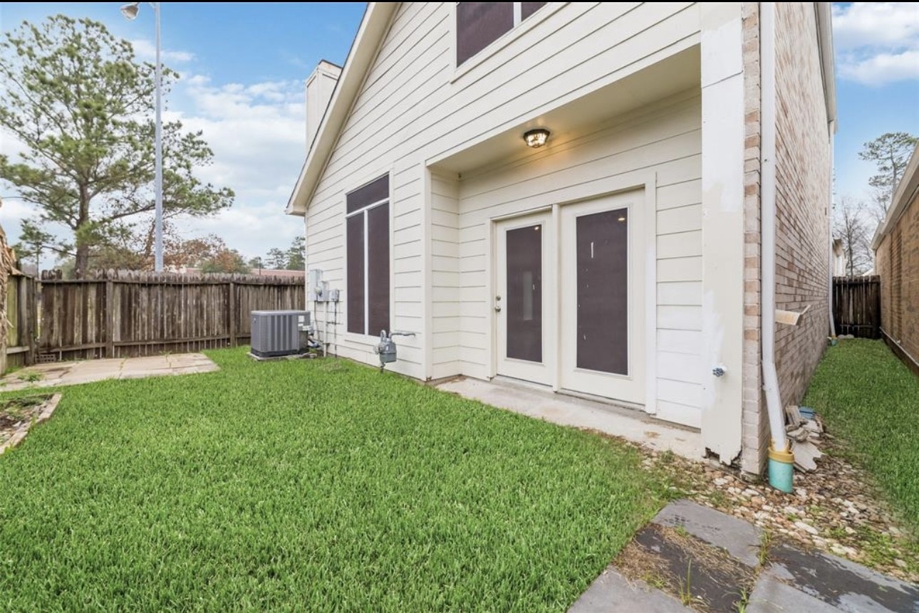 18715 Scented Candle Way Spring, TX 77388 - Photo 6 of 24 a view of a house with a yard