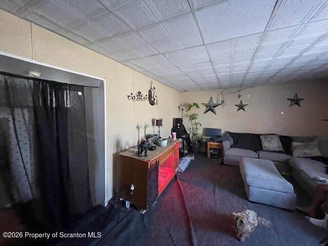 906 Capouse Avenue Scranton, PA 18509 - Photo 11 of 27 a living room with furniture a flat screen tv and a table