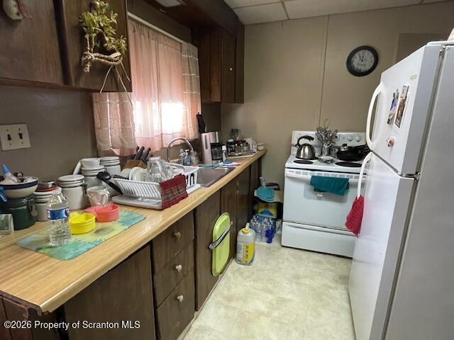 906 Capouse Avenue Scranton, PA 18509 - Photo 16 of 27 a kitchen with stainless steel appliances granite countertop a sink stove and refrigerator