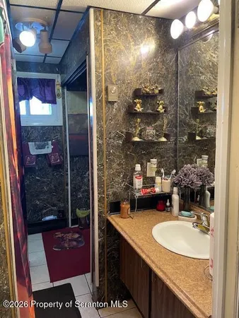 a bedroom with a bed and a night stand