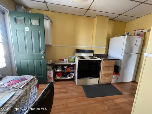 906 Capouse Avenue Scranton, PA 18509 - Photo 27 of 27 a living room with a bed and a table