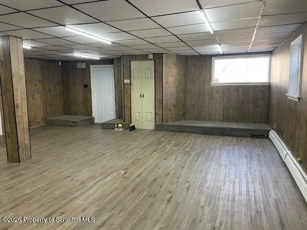 a view of gallery with wooden floor