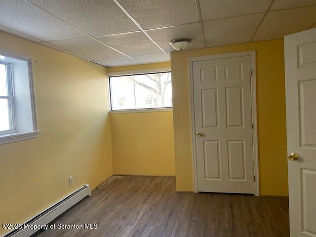 906 Capouse Avenue Scranton, PA 18509 - Photo 5 of 27 an empty room with wooden floor and windows