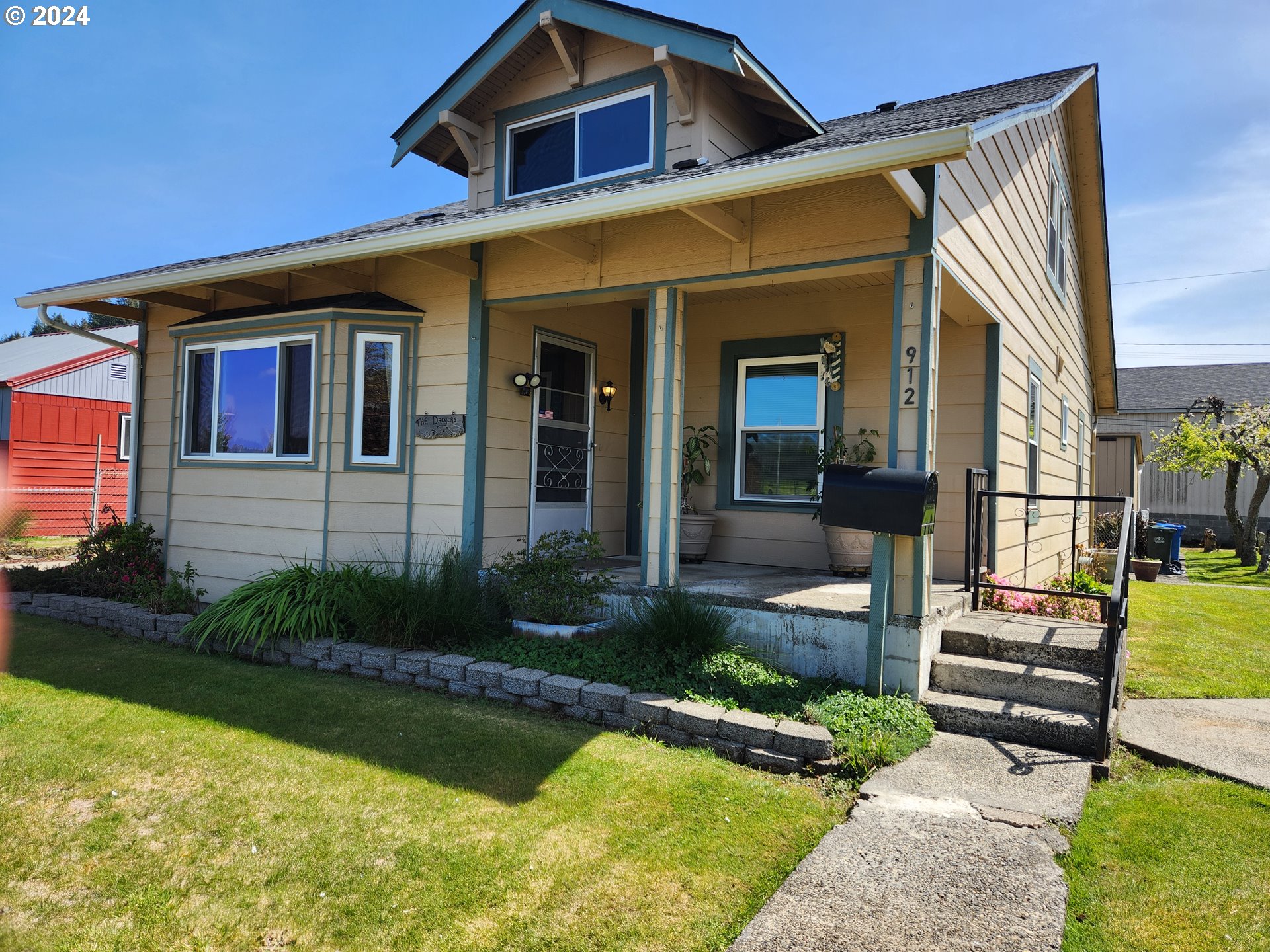 912 Fir Avenue Reedsport, OR 97467 - Photo 1 of 40 a front view of a house with garden