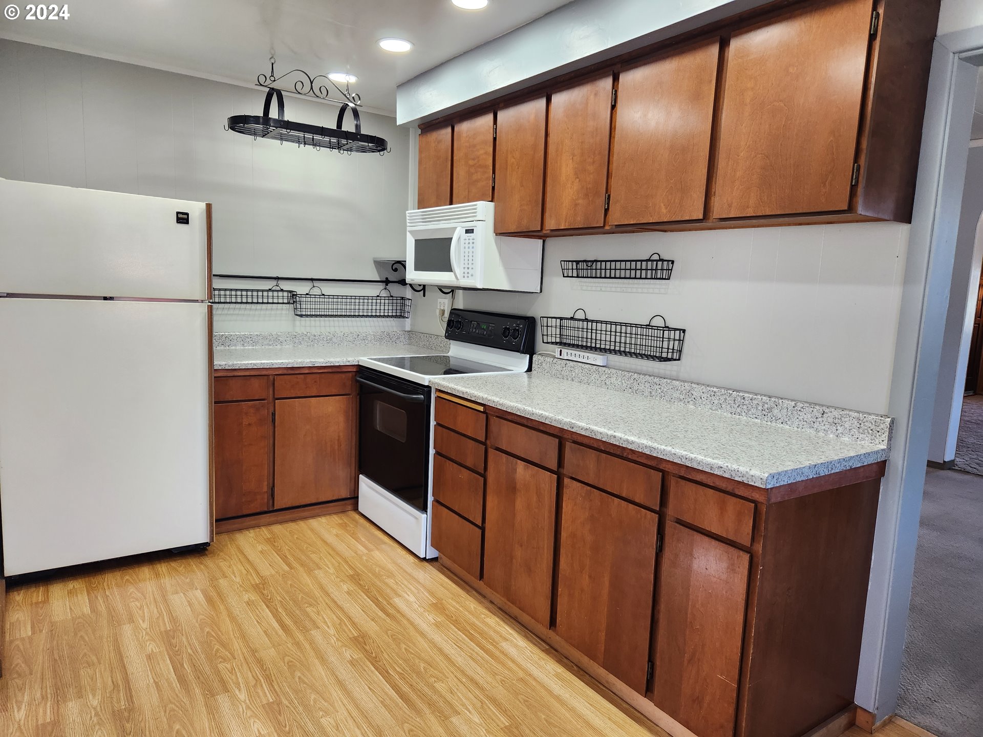 912 Fir Avenue Reedsport, OR 97467 - Photo 20 of 40 a kitchen with stainless steel appliances granite countertop a sink stove and cabinets