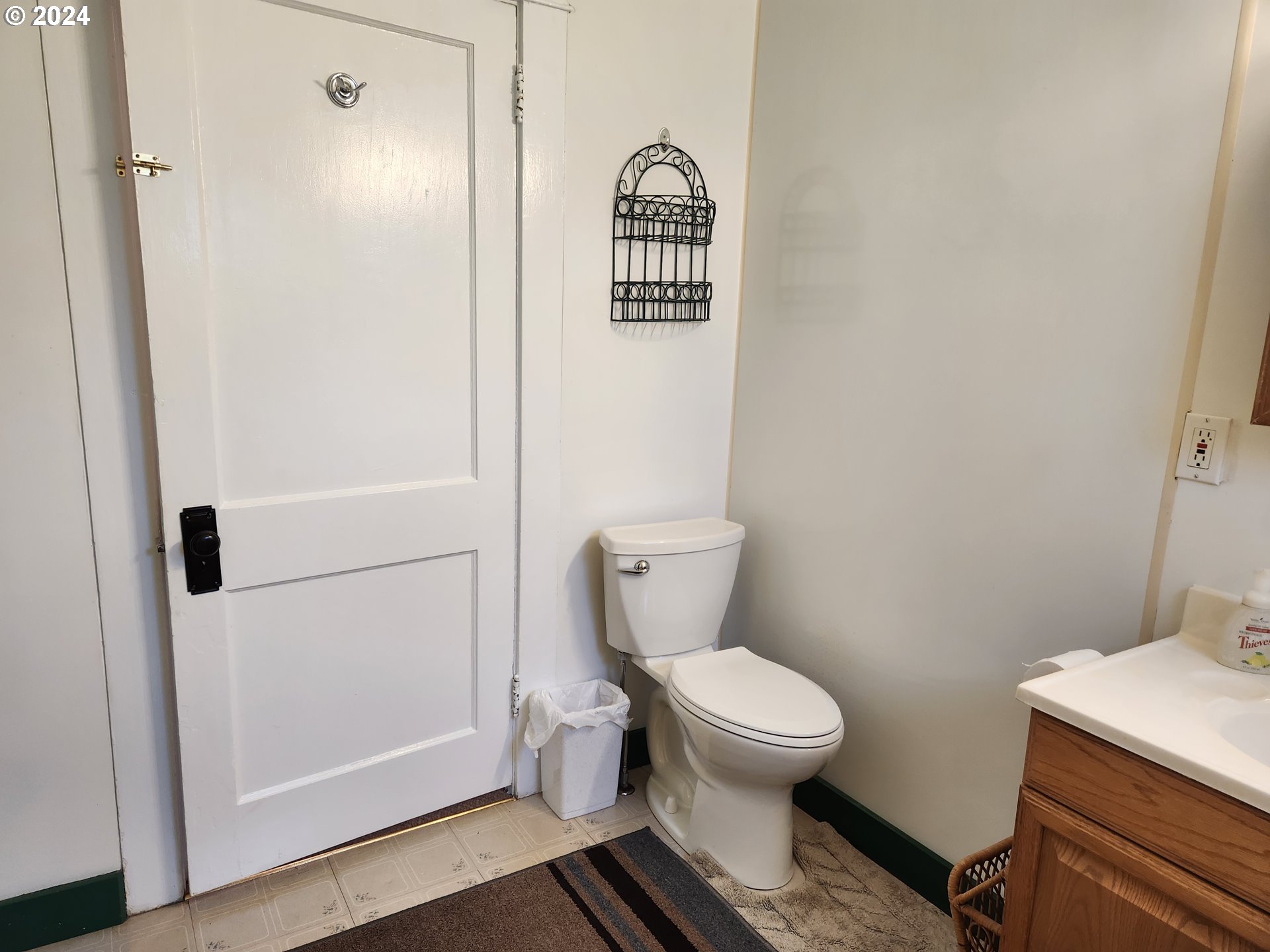 912 Fir Avenue Reedsport, OR 97467 - Photo 25 of 40 a white toilet sitting next to a bathroom sink