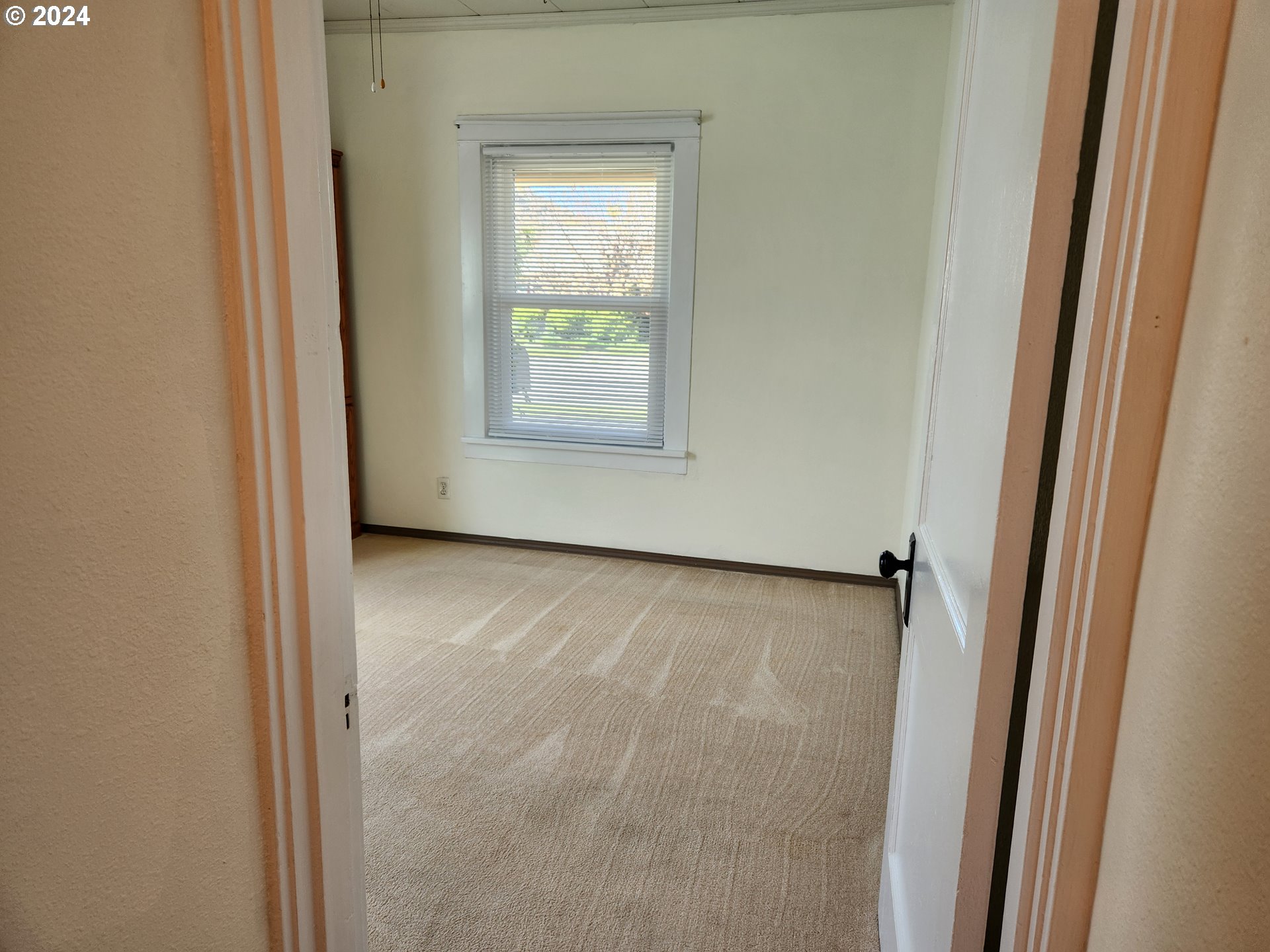 912 Fir Avenue Reedsport, OR 97467 - Photo 26 of 40 a view of a room that has a window in it