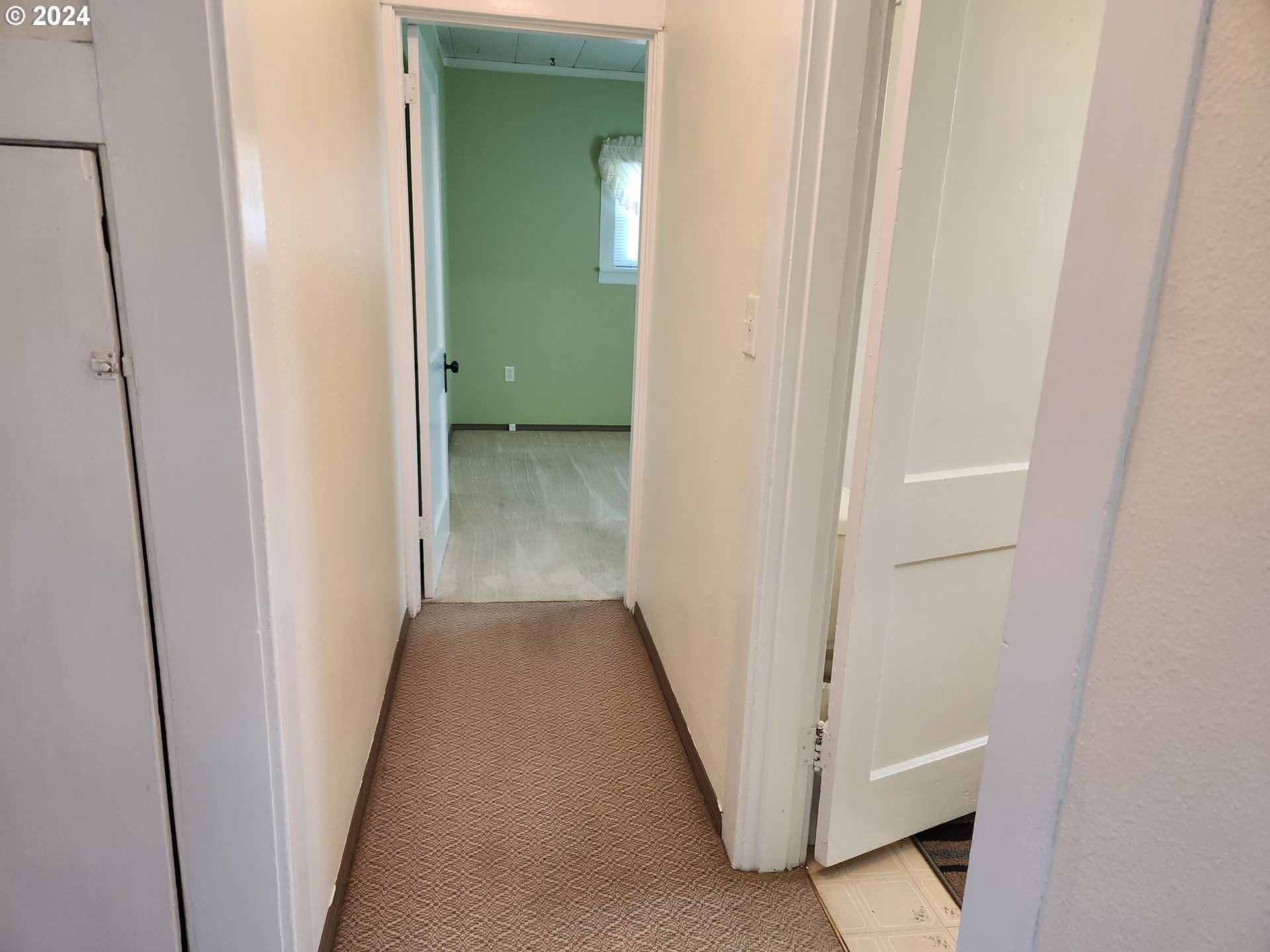 912 Fir Avenue Reedsport, OR 97467 - Photo 28 of 40 a view of a hallway with wooden floor