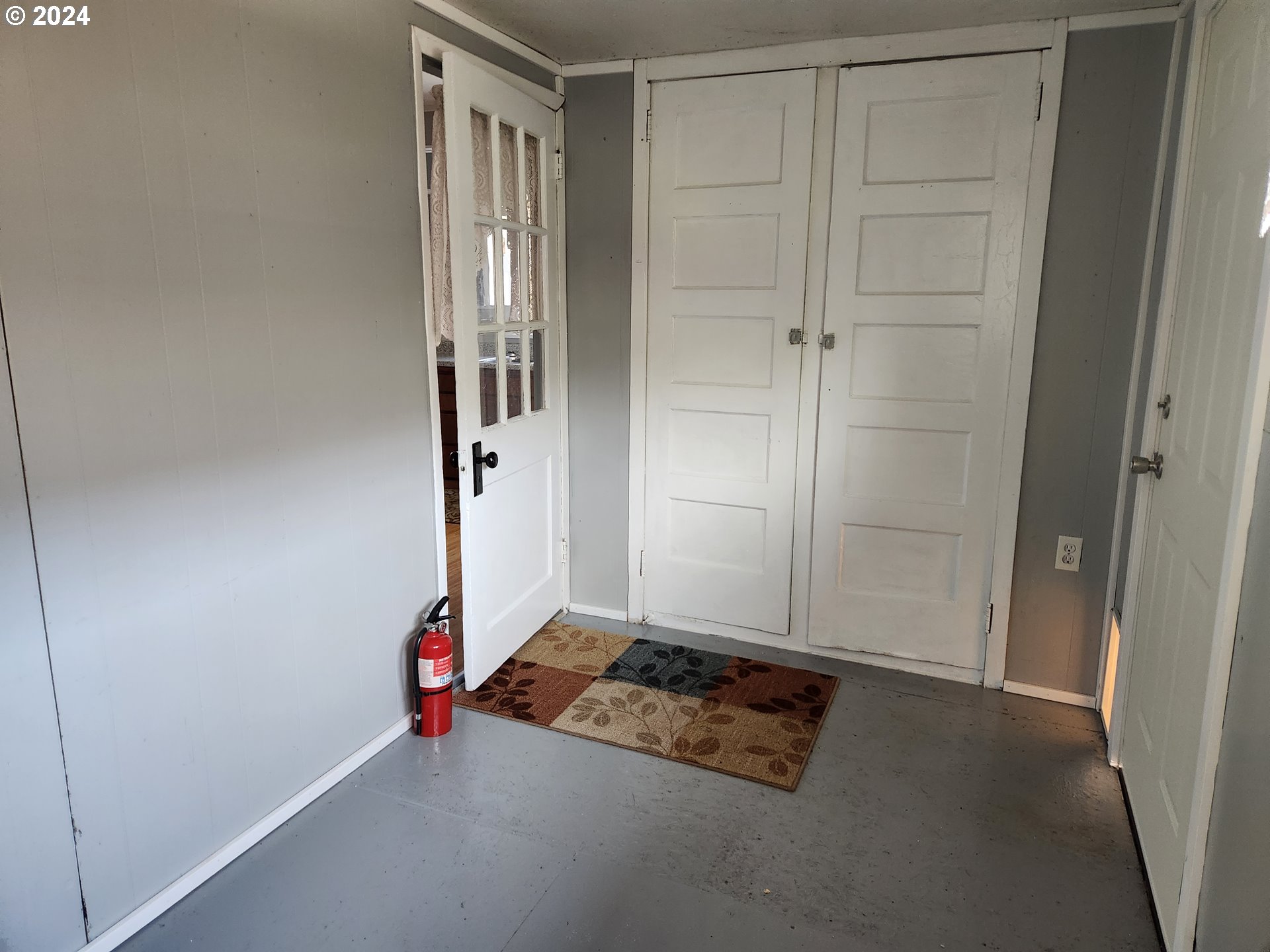 912 Fir Avenue Reedsport, OR 97467 - Photo 39 of 40 an empty room with a door