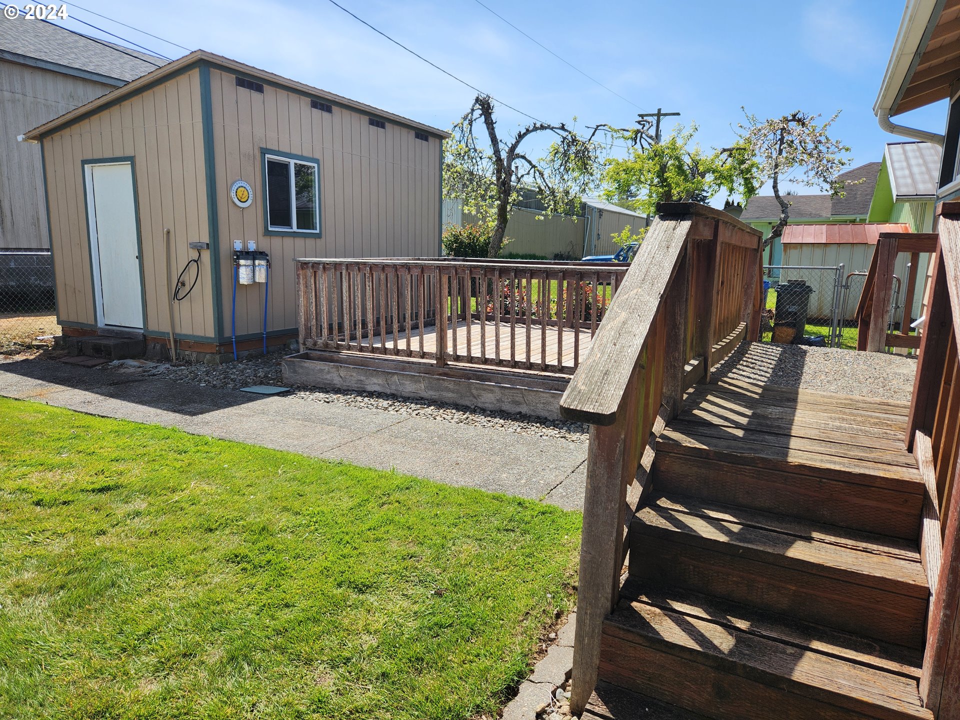 912 Fir Avenue Reedsport, OR 97467 - Photo 7 of 40 a view of a house with backyard and wooden fence