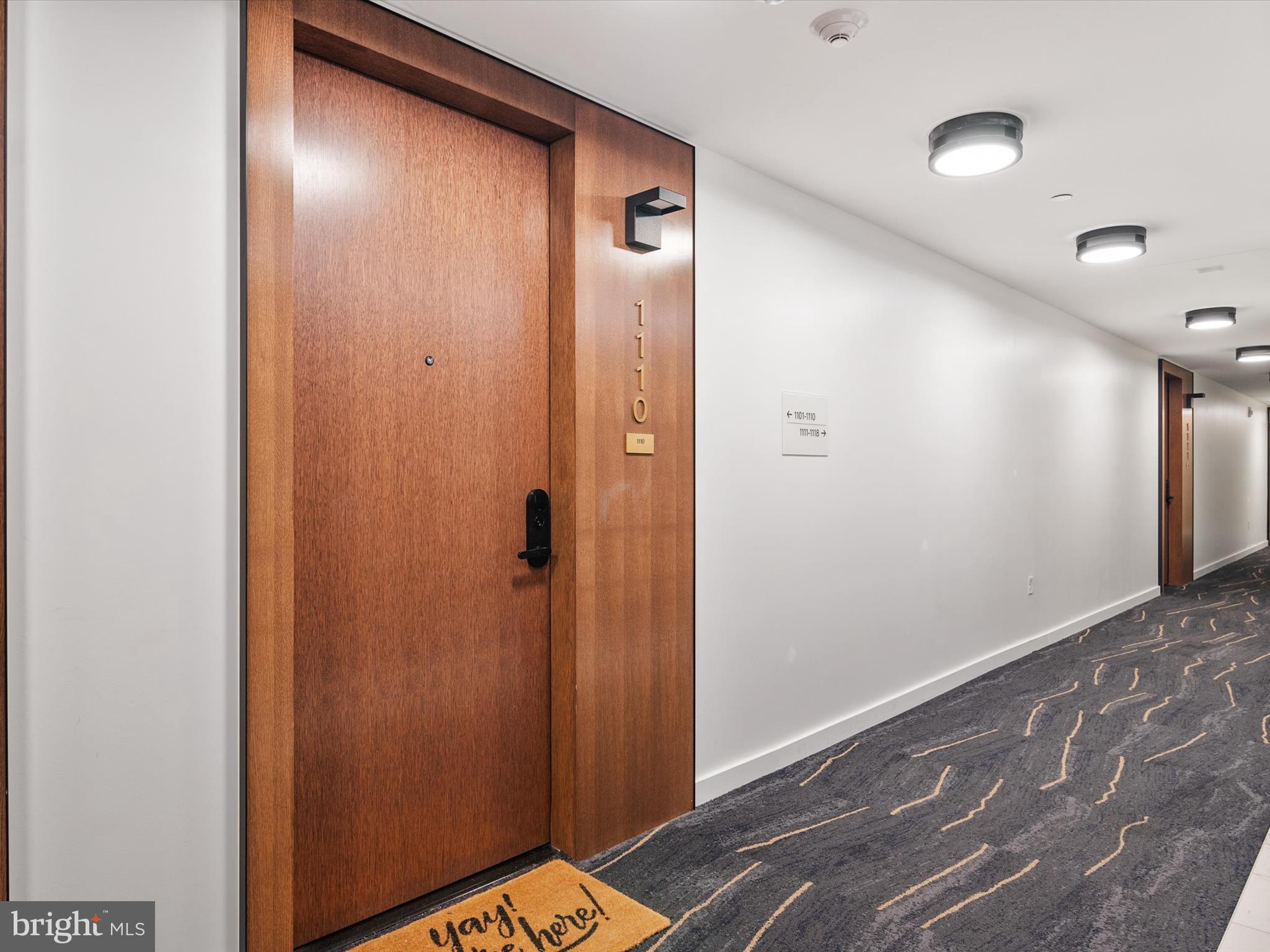 1211 Van Street Southeast, Unit 1110 Washington, DC 20003 - Photo 18 of 46 a view of a hallway with wooden floor