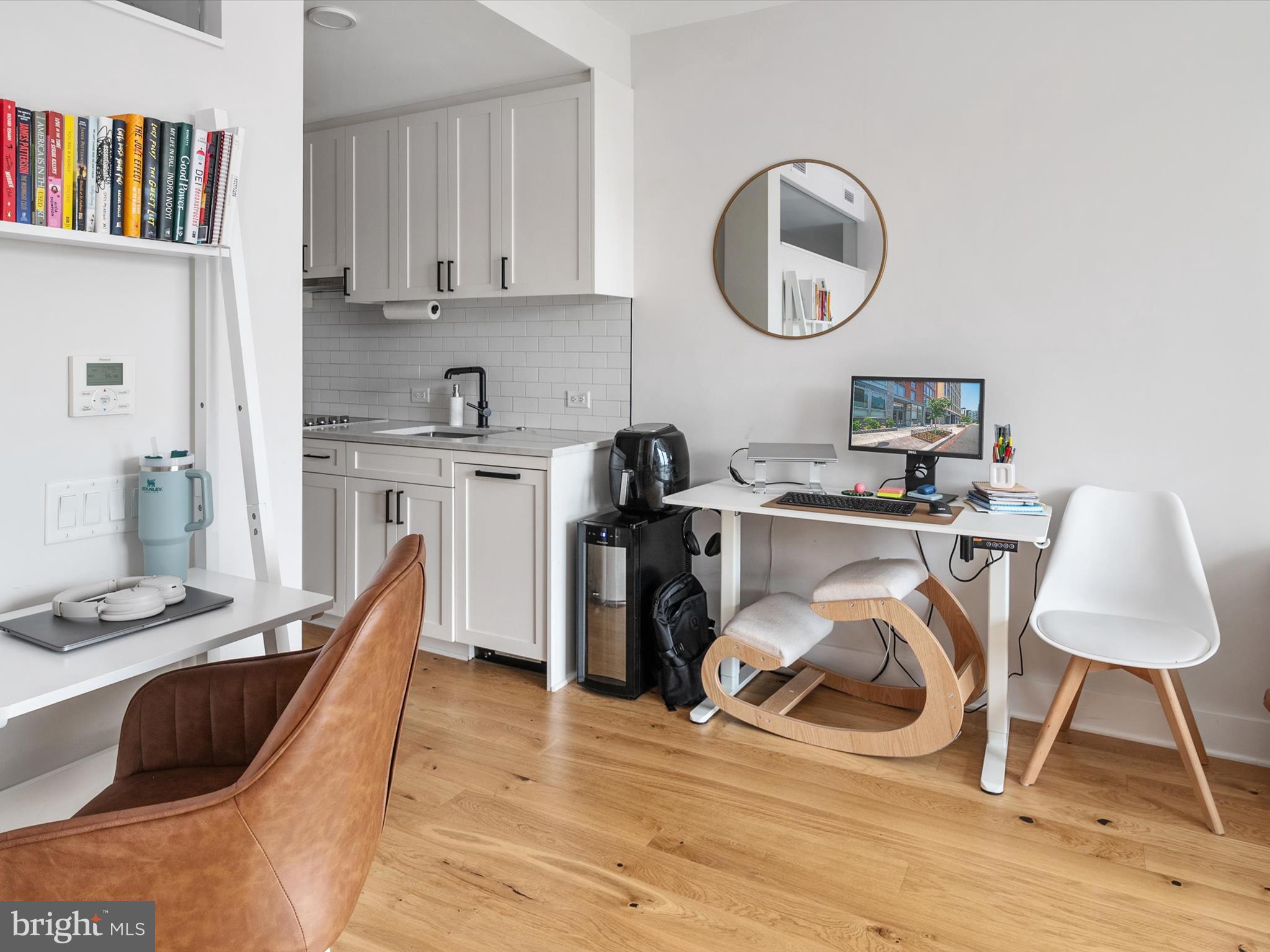 1211 Van Street Southeast, Unit 1110 Washington, DC 20003 - Photo 24 of 46 a view of a kitchen with workspace and furniture
