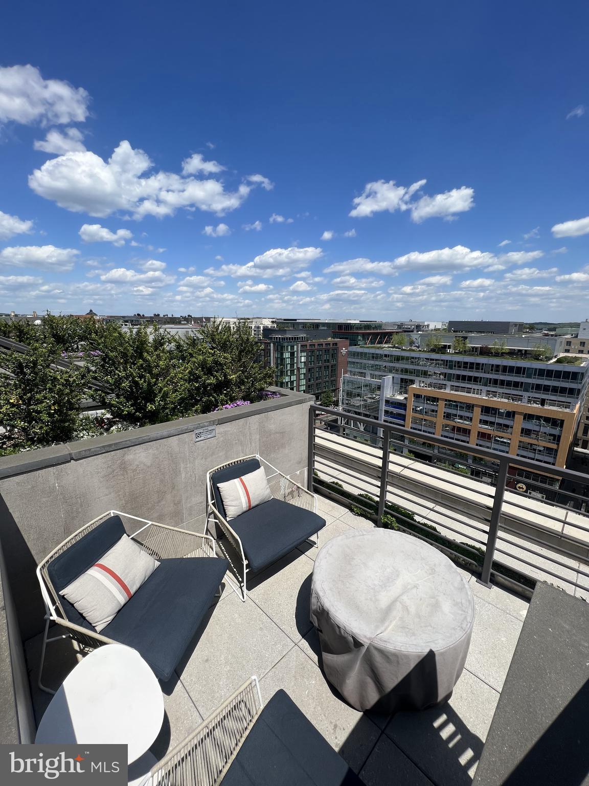 1211 Van Street Southeast, Unit 1110 Washington, DC 20003 - Photo 10 of 46 a view of a balcony with a table and chairs