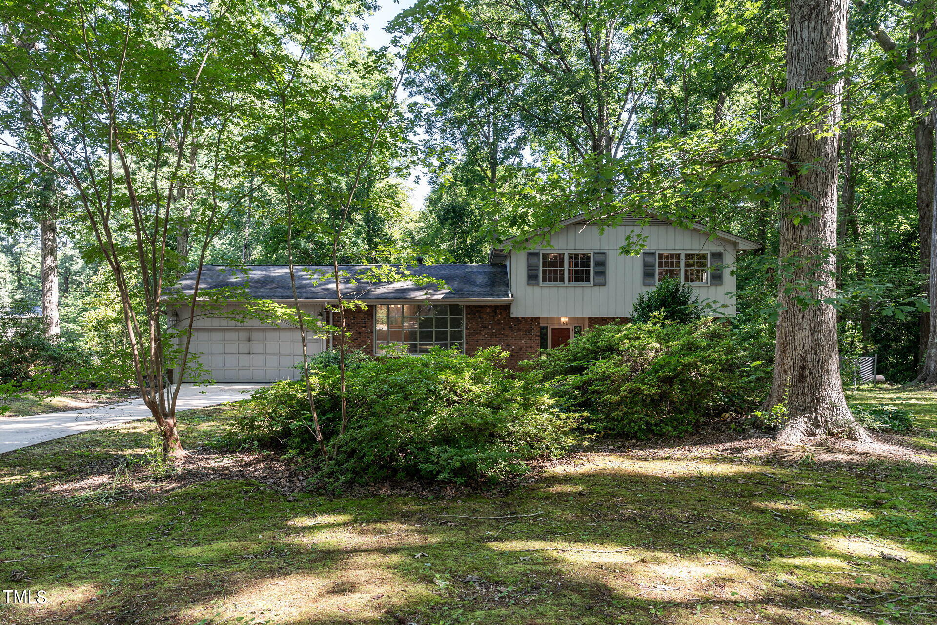 6604 Brandywine Road Raleigh, NC 27607 - Photo 1 of 46 a front view of a house with a yard and large trees