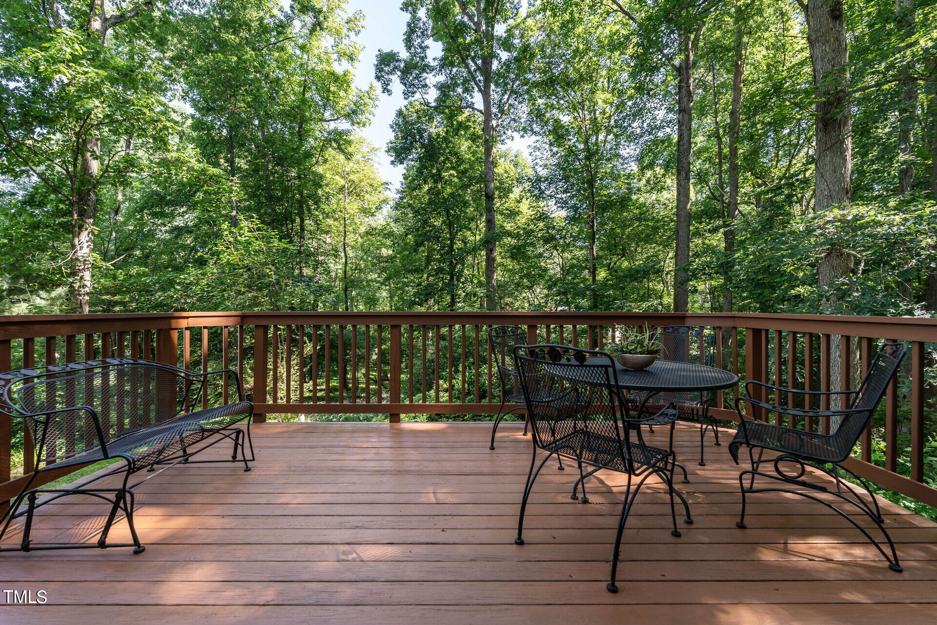 6604 Brandywine Road Raleigh, NC 27607 - Photo 11 of 46 a view of a deck with chairs and wooden floor