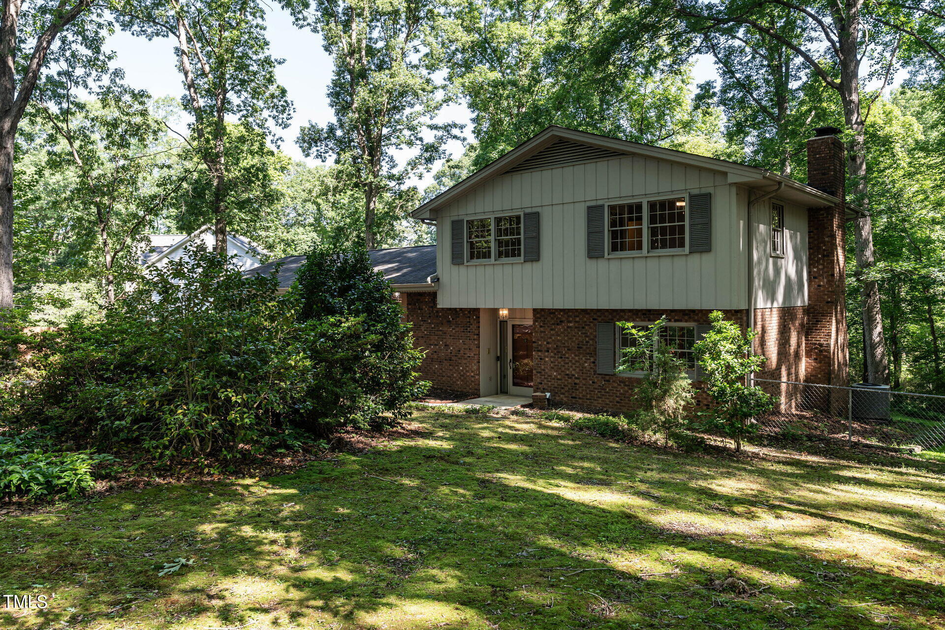 6604 Brandywine Road Raleigh, NC 27607 - Photo 14 of 46 a front view of a house with a yard
