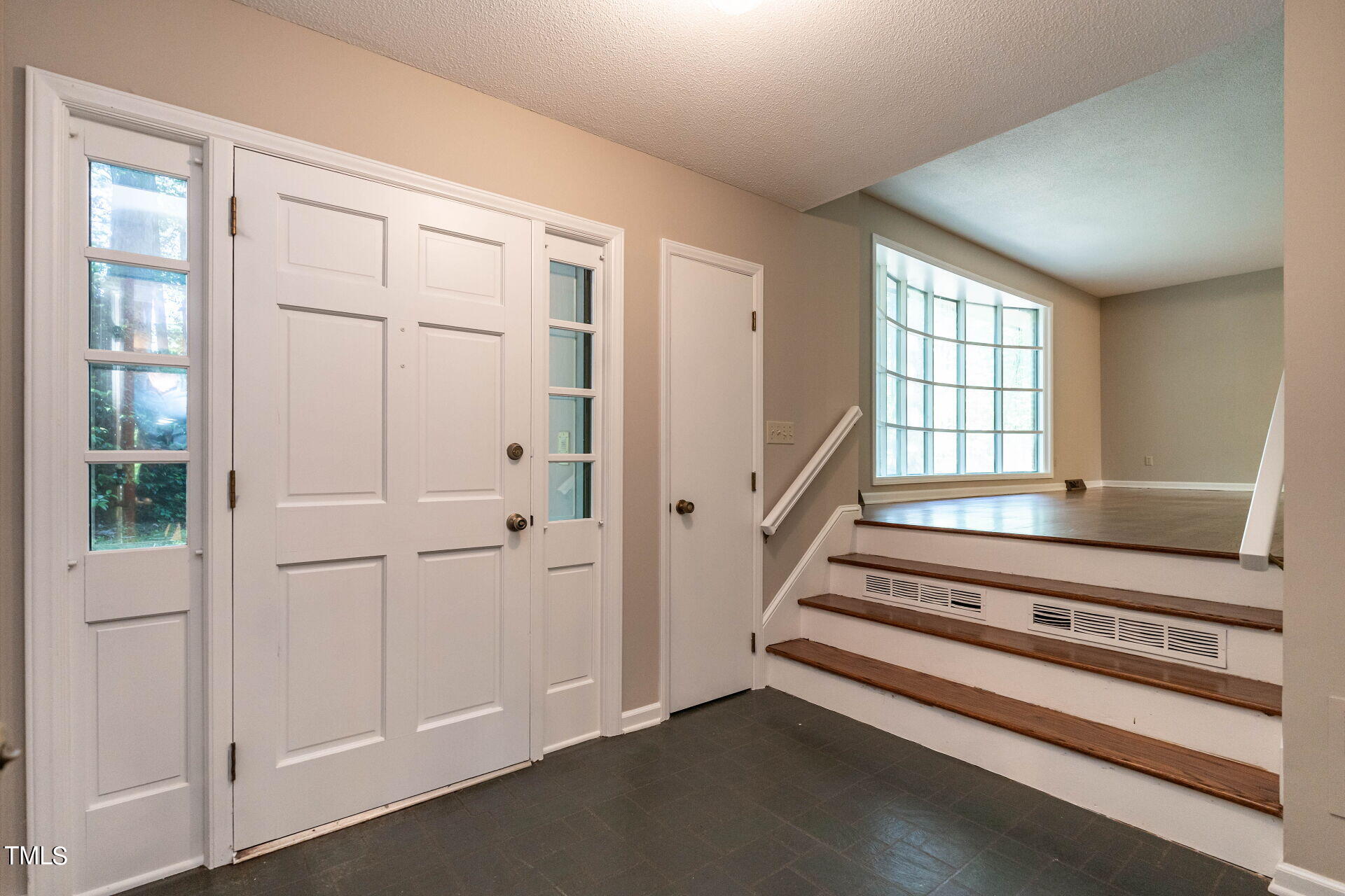 6604 Brandywine Road Raleigh, NC 27607 - Photo 16 of 46 a view of a hallway with windows